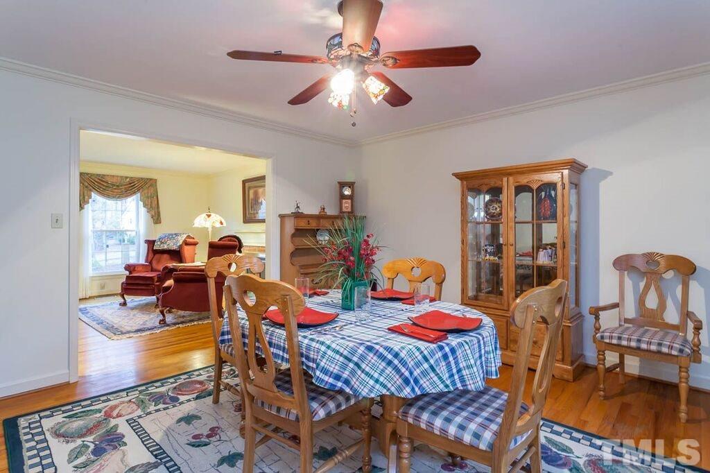 2903 Buckingham Road Durham, NC 27707 - Photo 5 of 15 a living room with furniture a rug and a chandelier