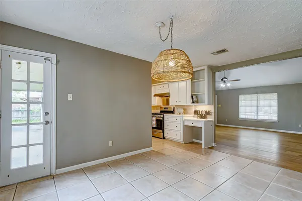a view of a kitchen with a sink and dishwasher cabinets