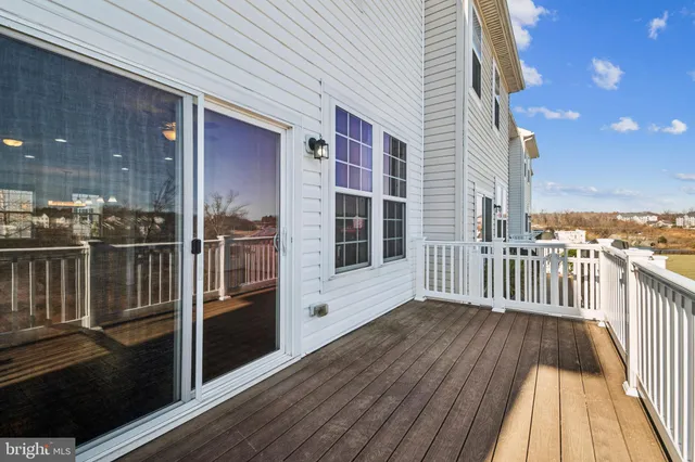 a view of a balcony with wooden floor
