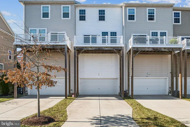 a view of a brick house with many windows