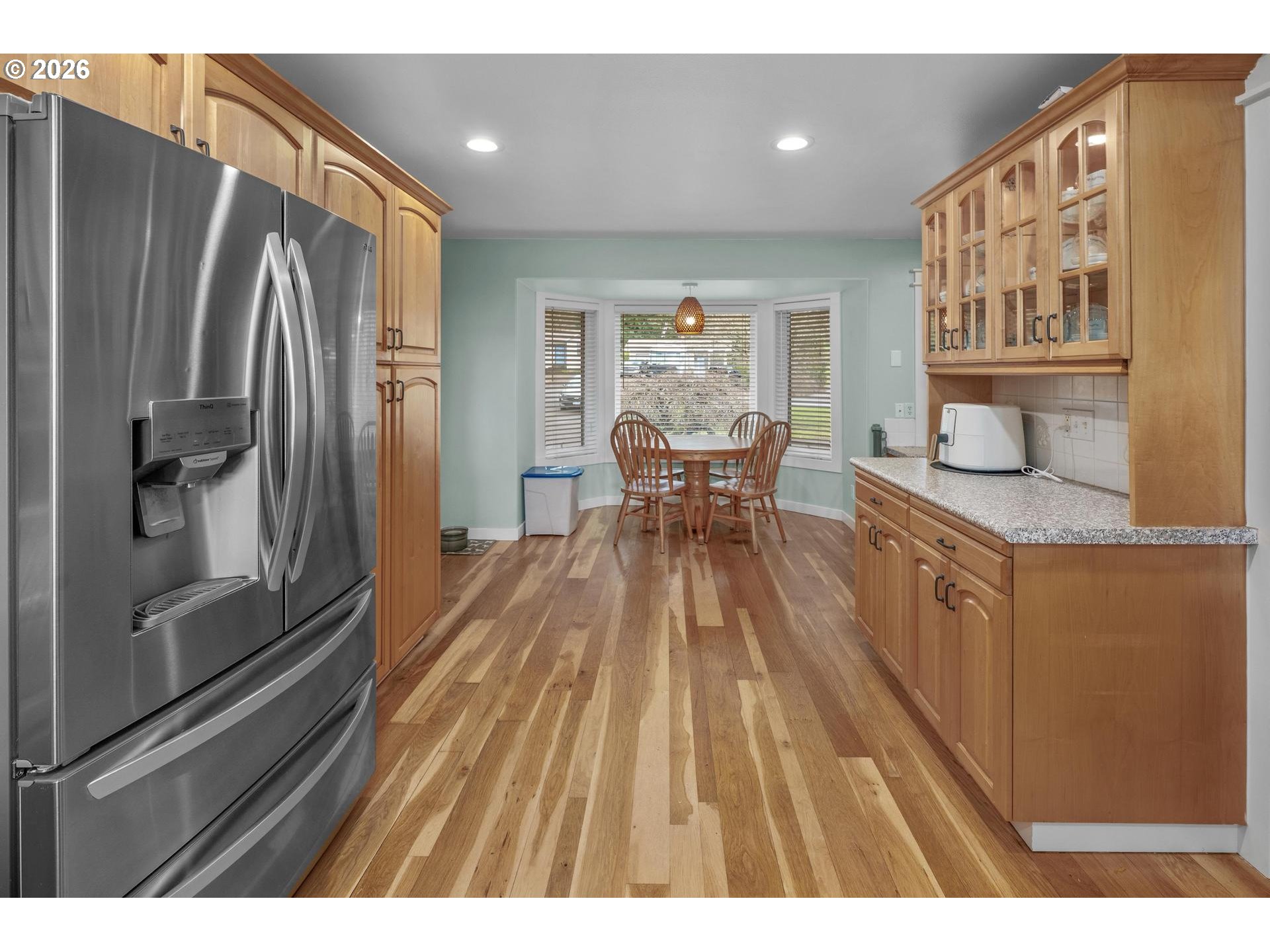 35254 Pittsburg Road St. Helens, OR 97051 - Photo 12 of 38 a kitchen with stainless steel appliances granite countertop a refrigerator a sink dishwasher a stove and white countertops with wooden floor
