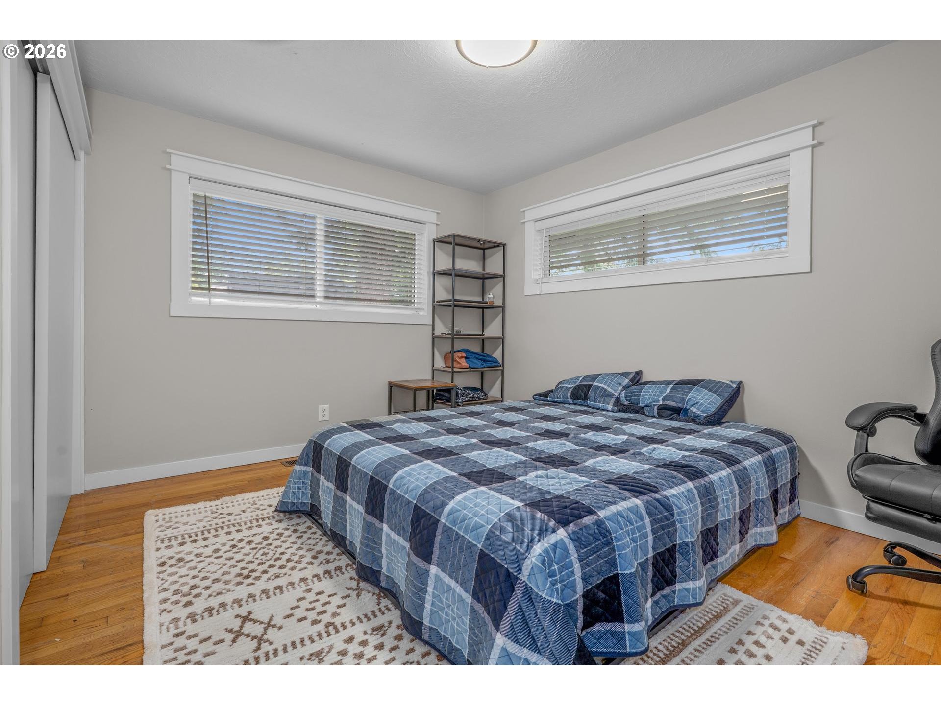 35254 Pittsburg Road St. Helens, OR 97051 - Photo 17 of 38 a bedroom with a bed a dresser and a window