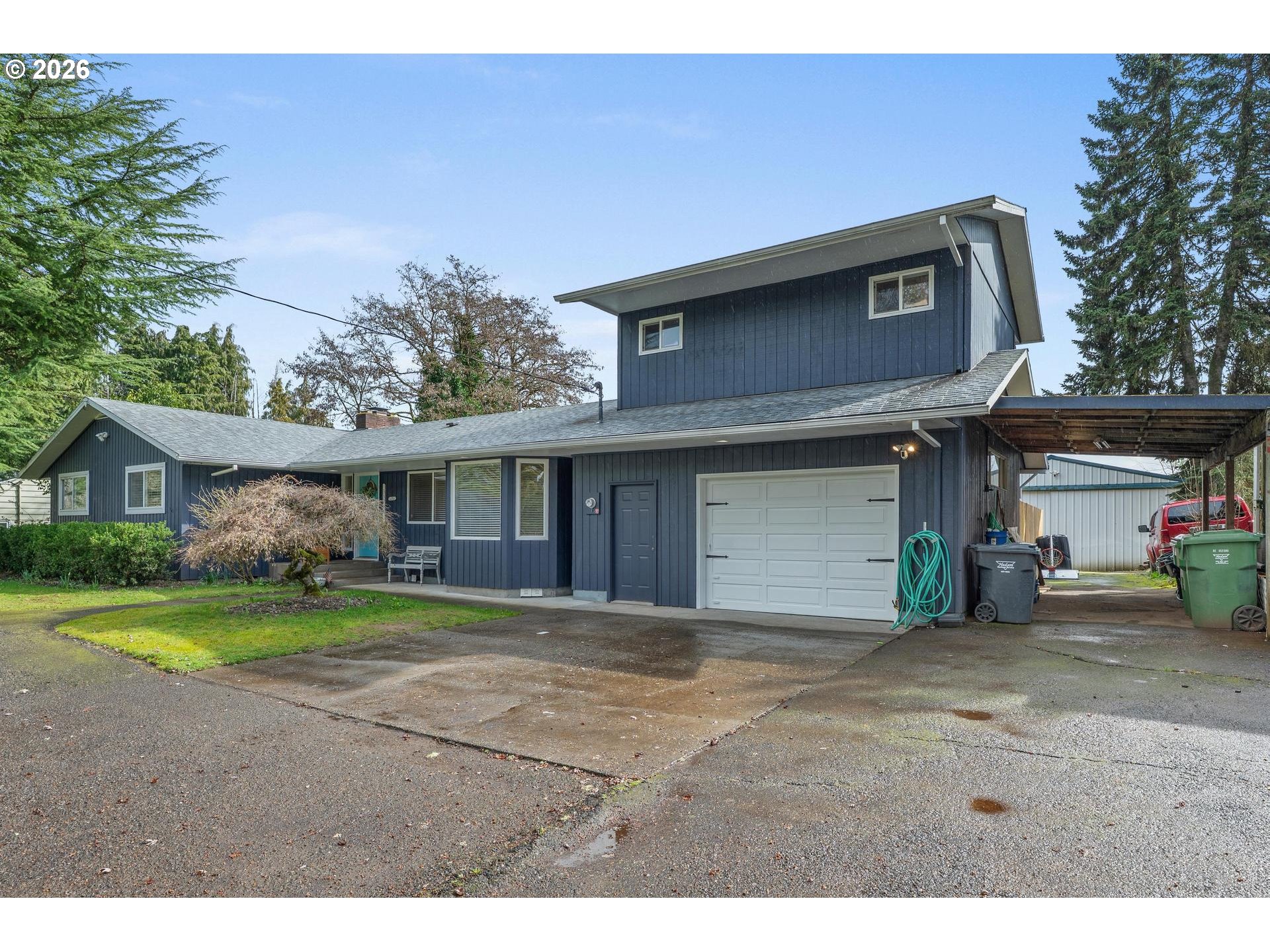 35254 Pittsburg Road St. Helens, OR 97051 - Photo 2 of 38 a view of a house with a yard and sitting area