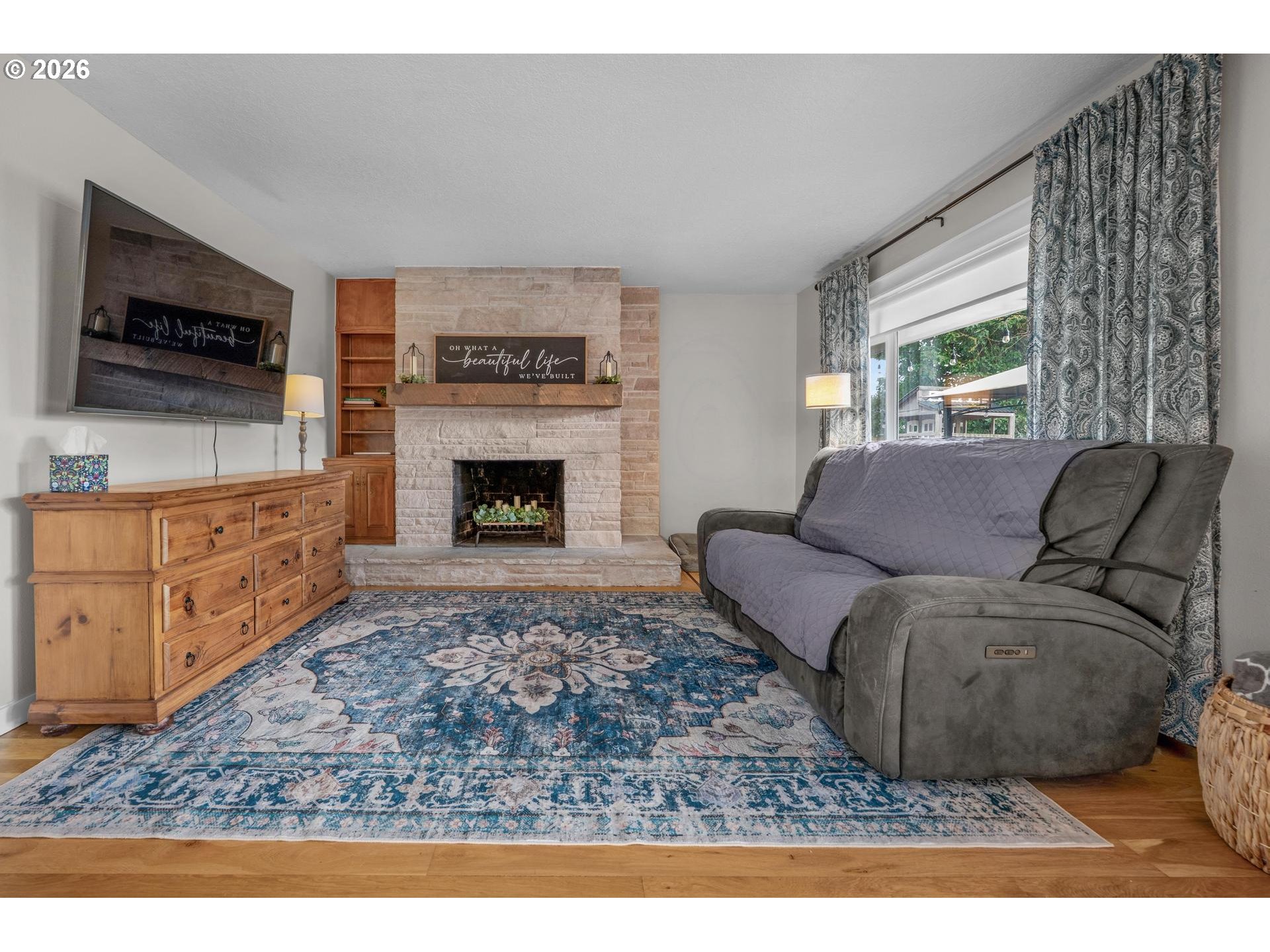 35254 Pittsburg Road St. Helens, OR 97051 - Photo 5 of 38 a living room with furniture a flat screen tv and a fireplace