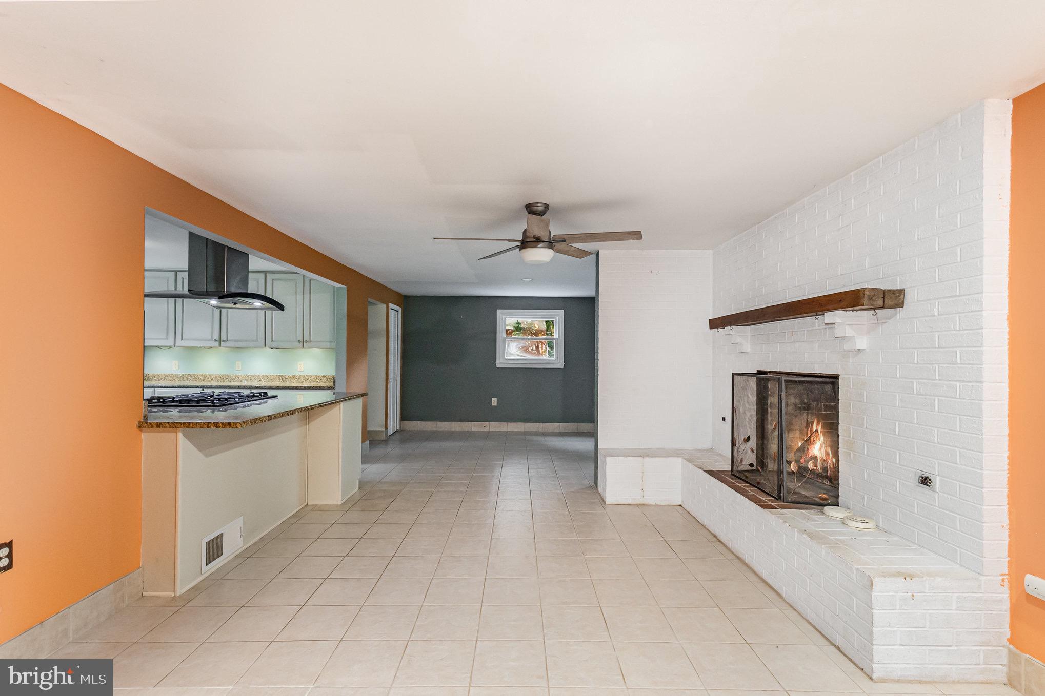 309 Williamsburg Road Sterling, VA 20164 - Photo 12 of 30 a large kitchen with a sink and a stove top oven