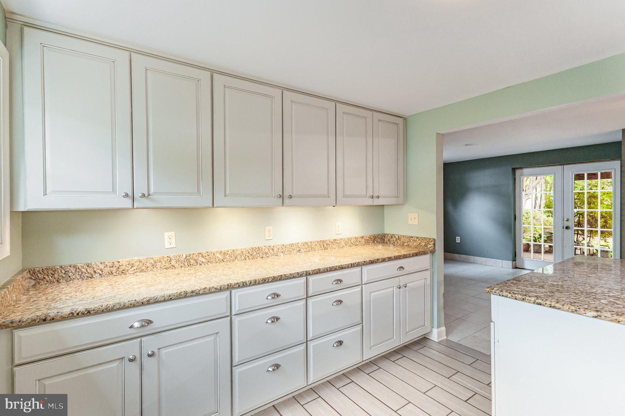309 Williamsburg Road Sterling, VA 20164 - Photo 15 of 30 a kitchen with granite countertop white cabinets and sink