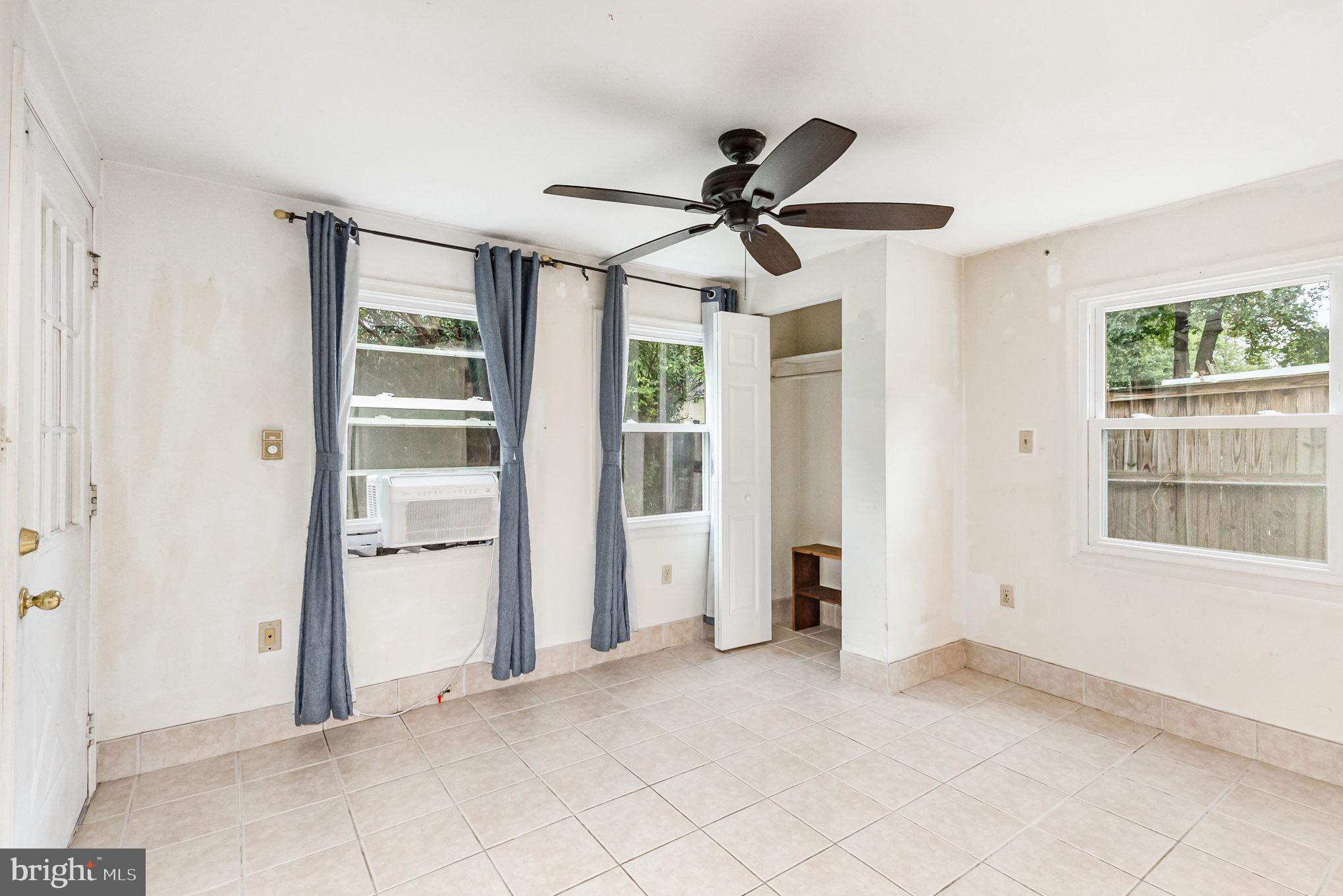309 Williamsburg Road Sterling, VA 20164 - Photo 16 of 30 a view of empty room with window and ceiling fan