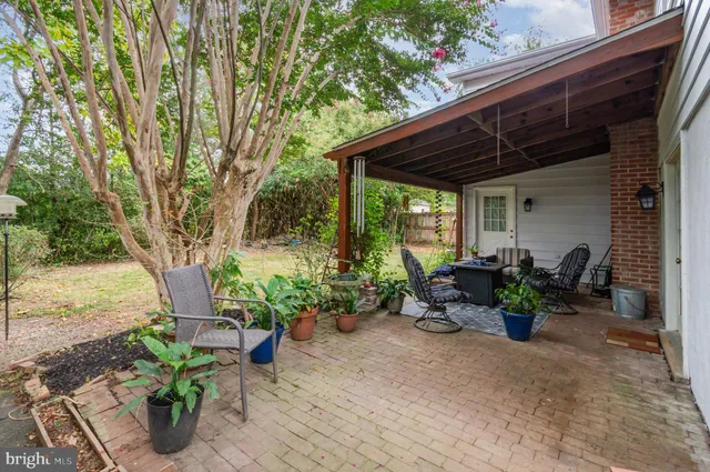 a view of a chairs and table in the patio