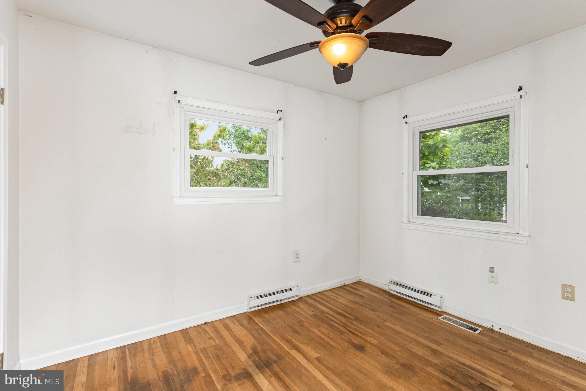 309 Williamsburg Road Sterling, VA 20164 - Photo 25 of 30 an empty room with window and wooden floor