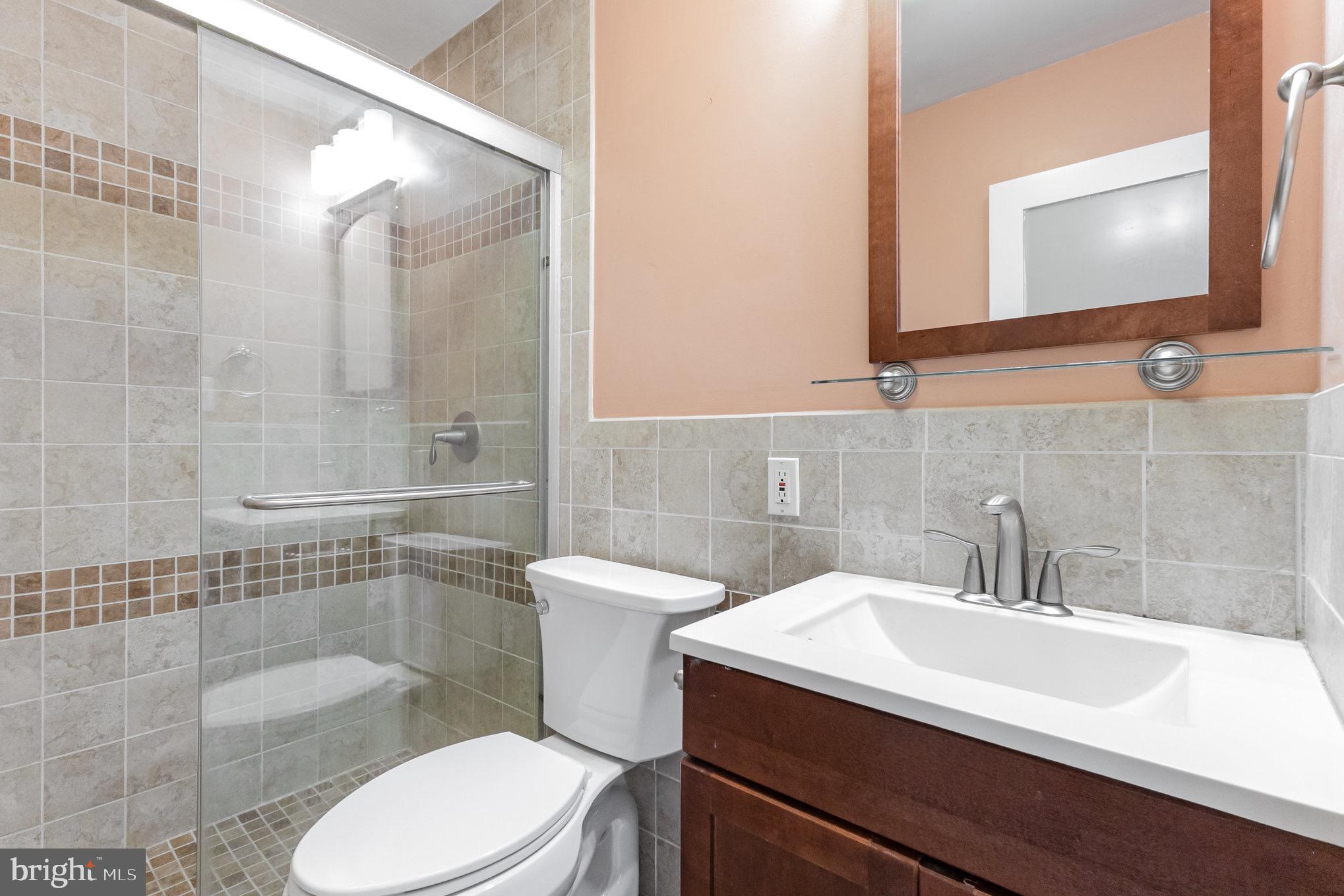 309 Williamsburg Road Sterling, VA 20164 - Photo 27 of 30 a bathroom with a sink a toilet and shower