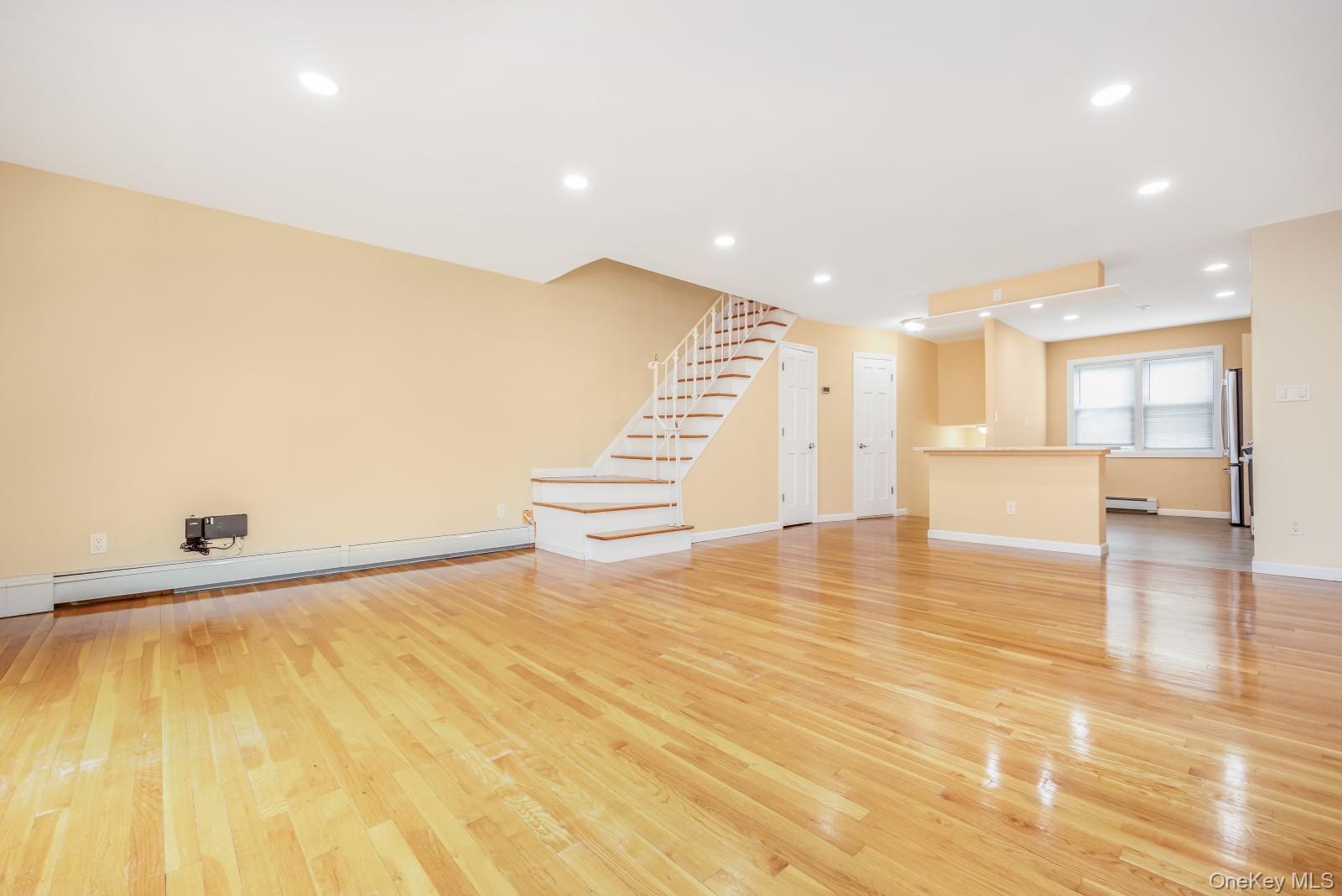 69-05 61st Road Queens, NY 11379 - Photo 12 of 31 a view of a kitchen with a sink and a stove