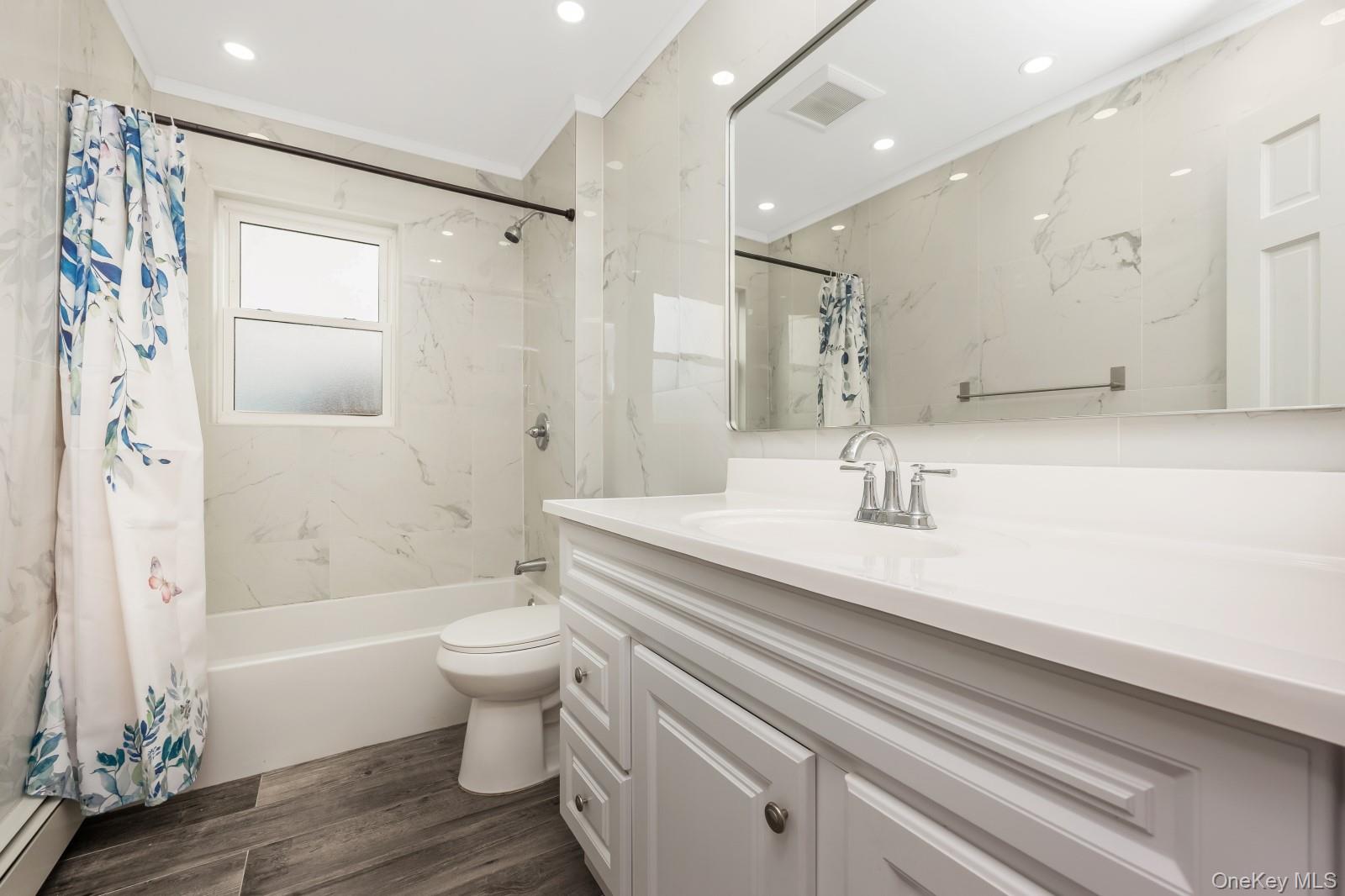 69-05 61st Road Queens, NY 11379 - Photo 19 of 31 a bathroom with a sink a toilet and shower