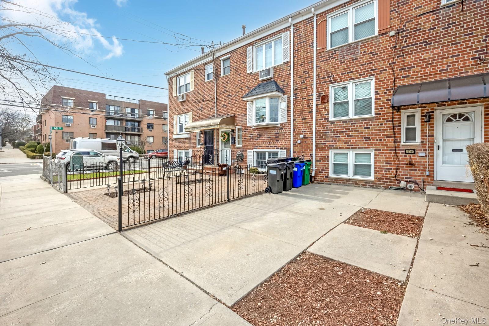 69-05 61st Road Queens, NY 11379 - Photo 3 of 31 a view of a building with a outdoor space