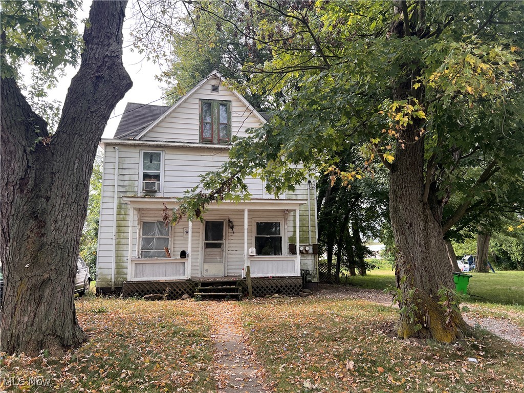 70 Salt Street Rittman, OH 44270 - Photo 1 of 16 American foursquare style home featuring a porch and a front yard