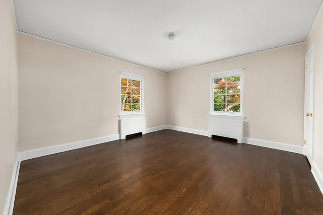 a bathroom with a granite countertop sink a mirror a shower and a bathtub
