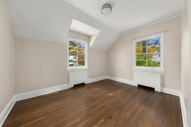 a bathroom with a granite countertop toilet a sink and a shower