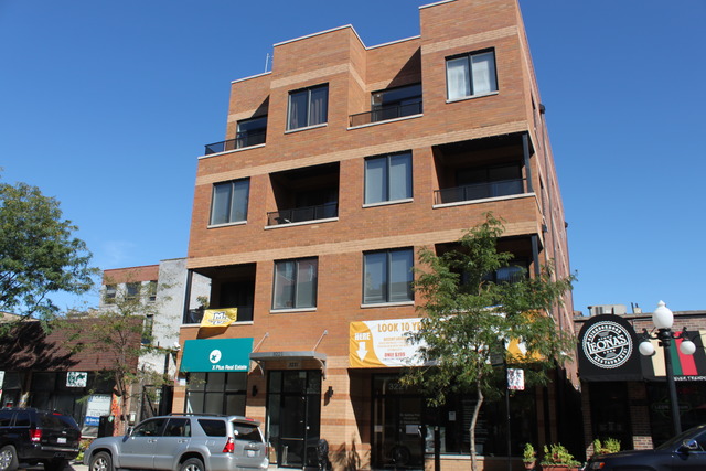 3221 North Sheffield Avenue, Unit 4S Chicago, IL 60657 - Photo 1 of 2 a view of a building with a clock on the wall