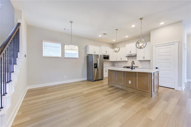 a view of kitchen and front door