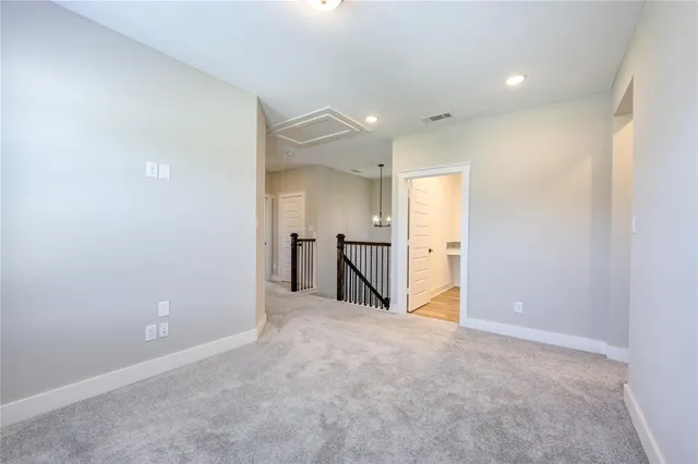 a view of a big room with closet and windows