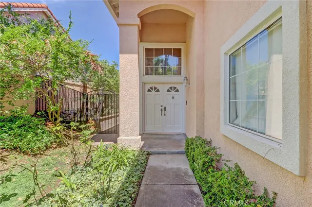 a bathroom with a granite countertop sink a mirror and shower