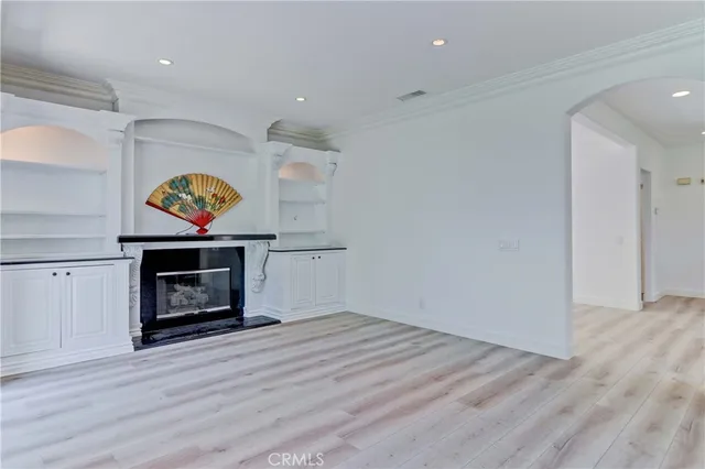 a kitchen with stainless steel appliances kitchen island granite countertop a refrigerator and a stove