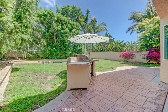 a patio with table and chairs