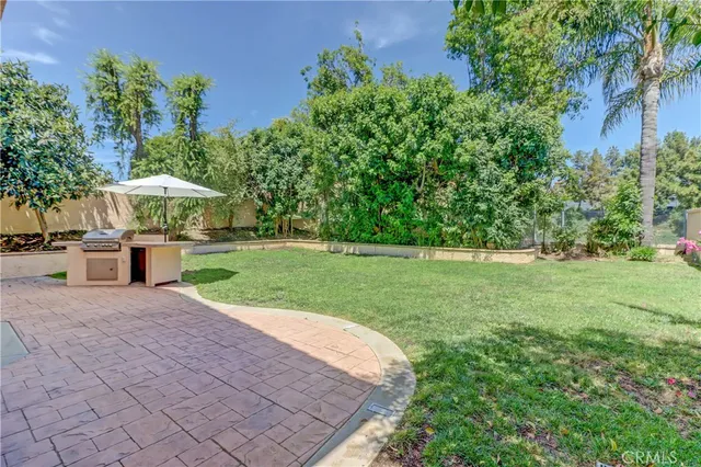 a view of a pathway both side of house