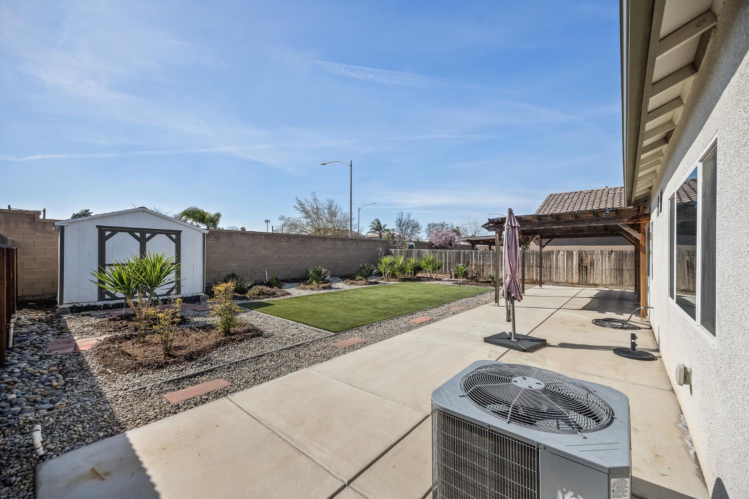701 Strada Street Lemoore, CA 93245 - Photo 23 of 25 a house view with a garden space