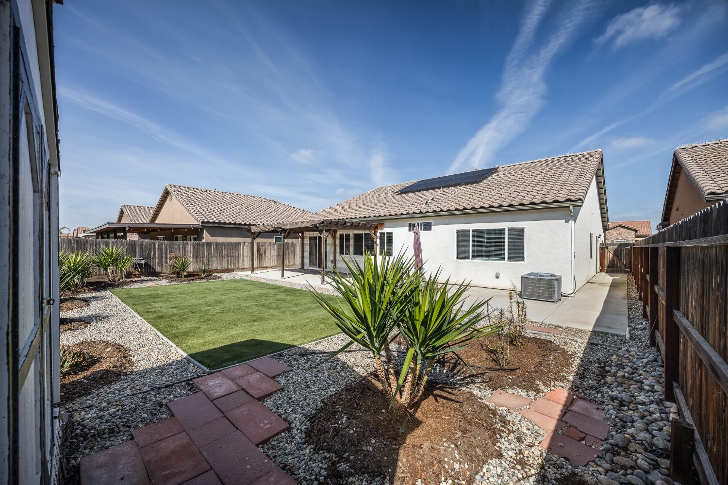 701 Strada Street Lemoore, CA 93245 - Photo 25 of 25 a front view of a house with garden