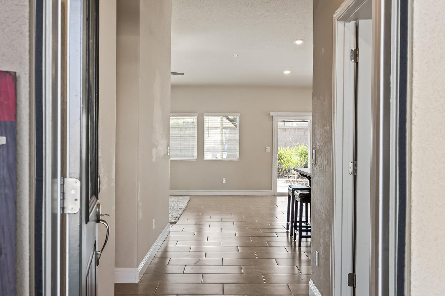 701 Strada Street Lemoore, CA 93245 - Photo 3 of 25 a view of entryway with wooden floor