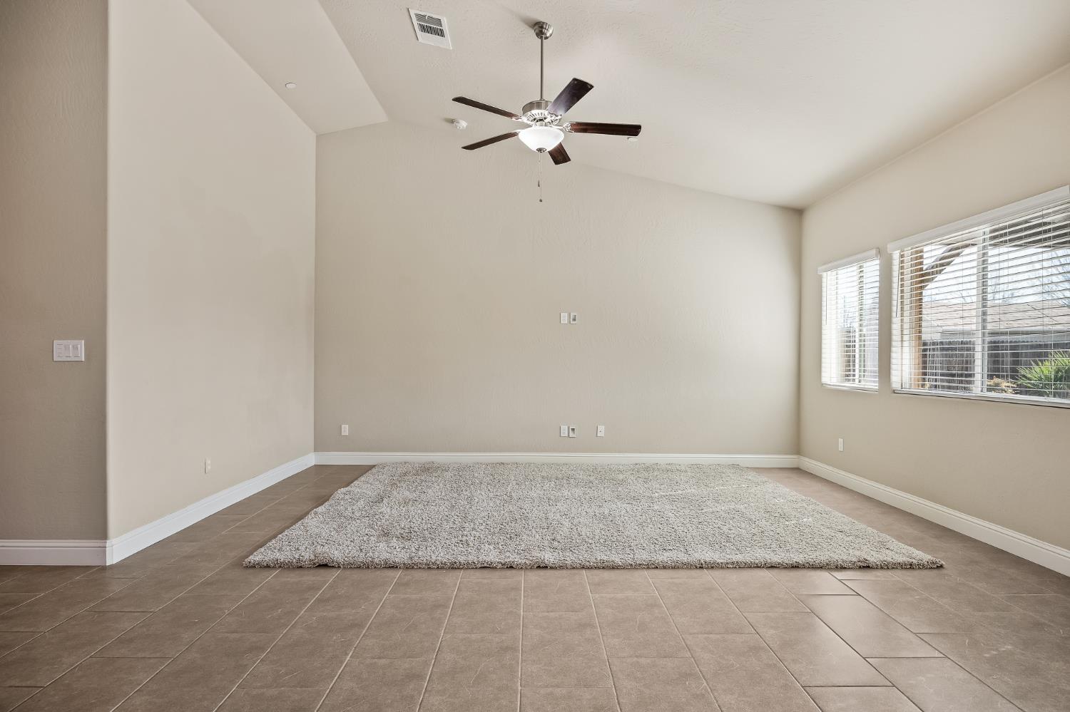 701 Strada Street Lemoore, CA 93245 - Photo 4 of 25 a view of an empty room with a window
