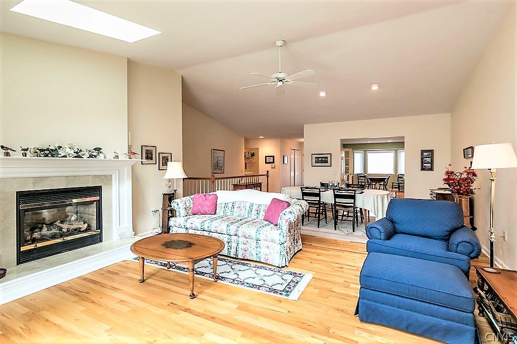 231 Oarlock Circle Manlius, NY 13057 - Photo 14 of 35 There is a two sided gas fireplace that opens to t
