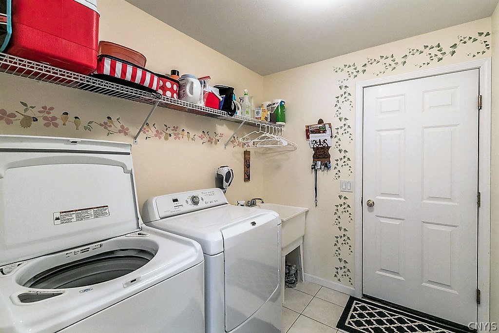 231 Oarlock Circle Manlius, NY 13057 - Photo 29 of 35 The first floor laundry is right off of the garage