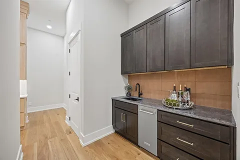 a kitchen with a sink and cabinets