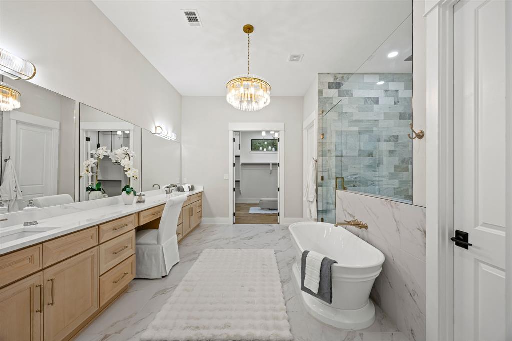 4208 Allencrest Lane Dallas, TX 75244 - Photo 14 of 40 a large bathroom with a double vanity sink a toilet a shower and a mirror