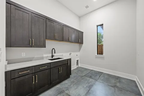 a kitchen with a sink and cabinets