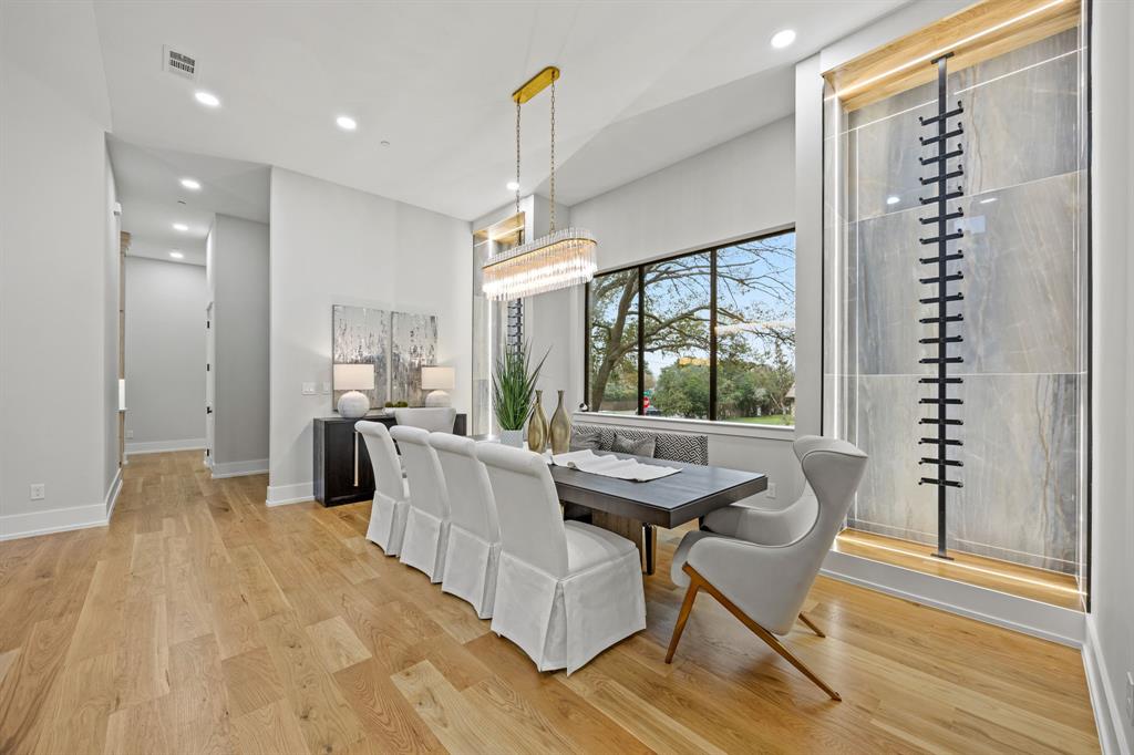 4208 Allencrest Lane Dallas, TX 75244 - Photo 5 of 40 a dining room with furniture a chandelier and wooden floor