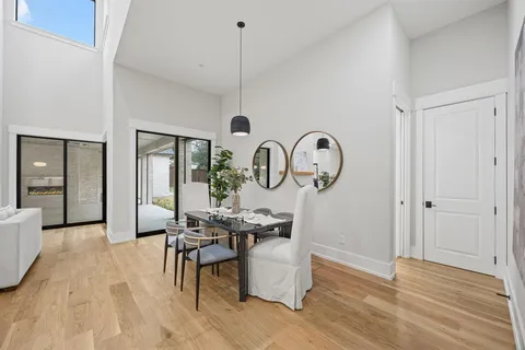 a view of dining room filled with furniture and wooden floor