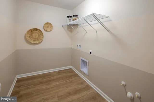 a view of a room with racks and a window