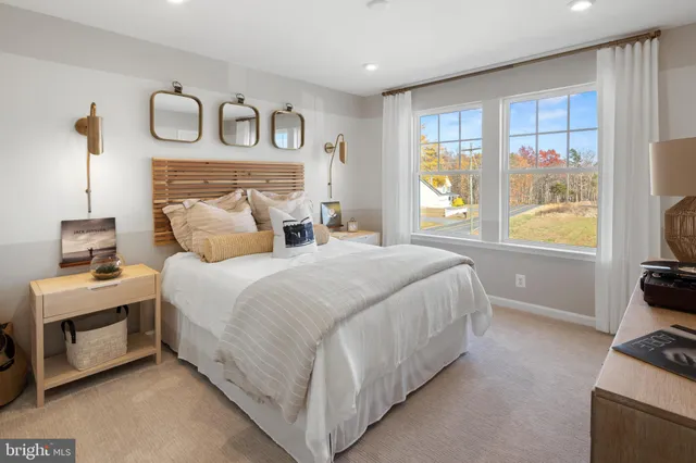 a bedroom with a bed and a tv