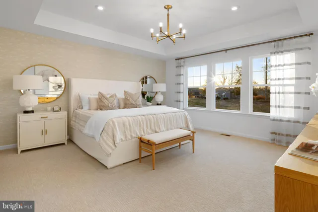 a bedroom with bed and window