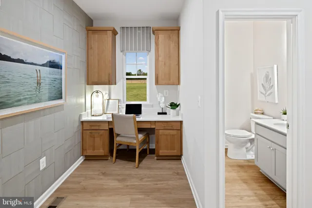 a bathroom with a sink a toilet and a shower