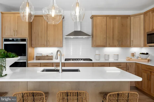 a kitchen with a table and chairs in it