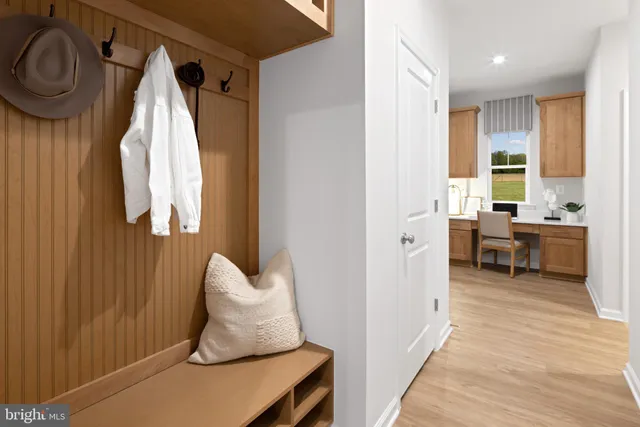 a view of a bedroom with window and furniture