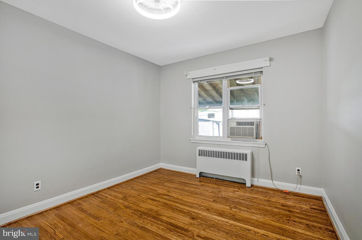 3040 Federal Street Baltimore, MD 21213 - Photo 15 of 41 a view of empty room with wooden floor and fan