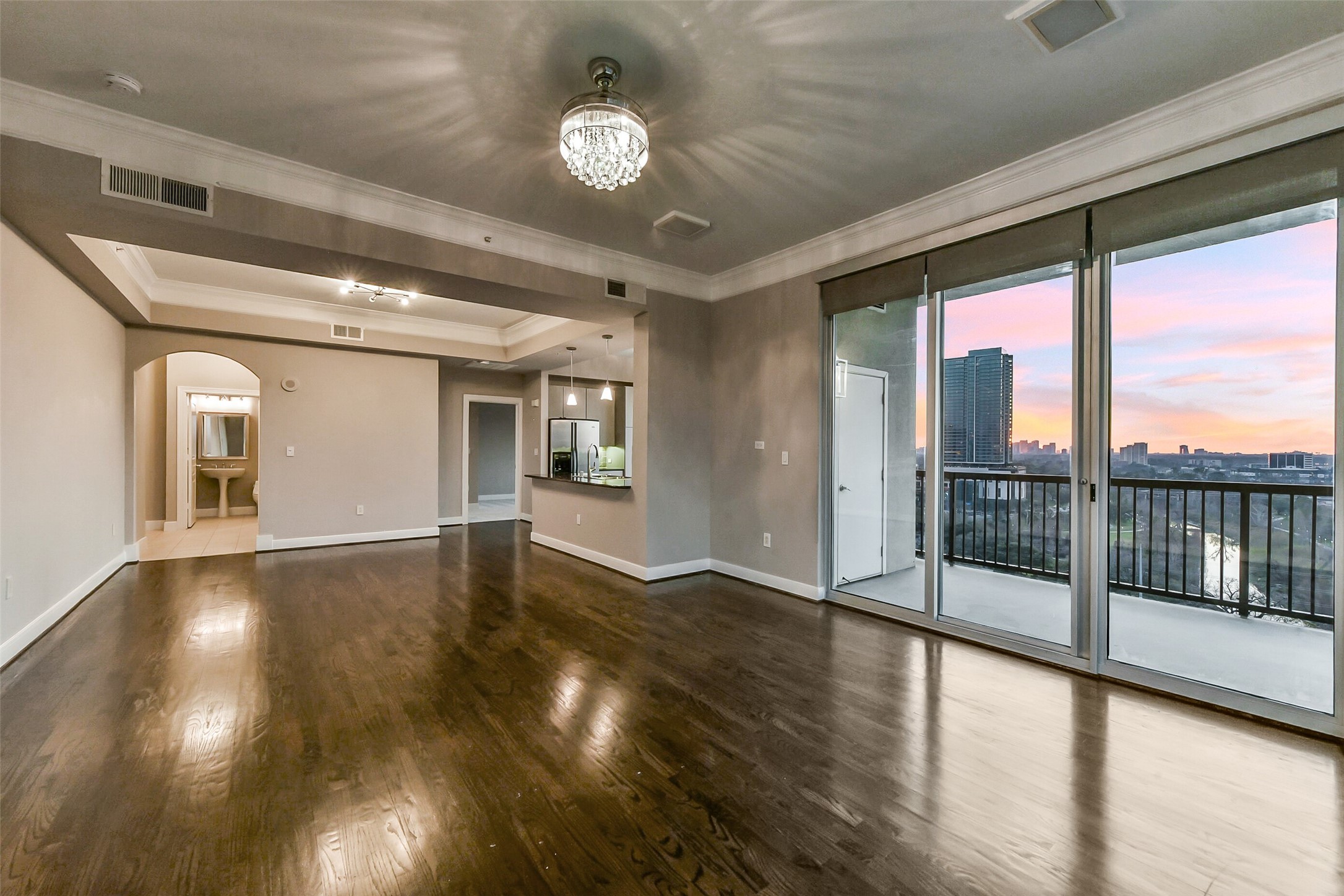 3333 Allen Parkway, Unit 1609 Houston, TX 77019 - Photo 2 of 33 Another view of the living areas looking back towards the kitchen as the sun set in the distance.