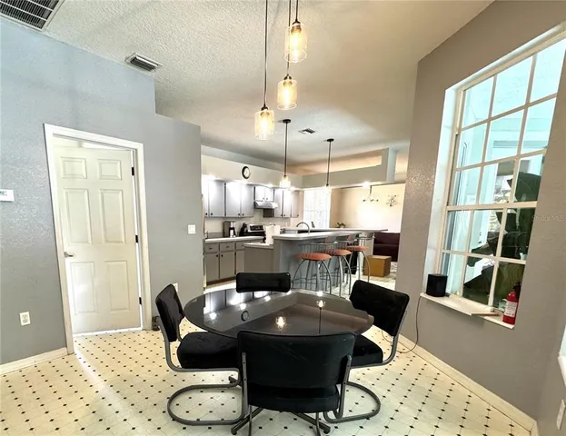 a utility room with a sink dryer and washer