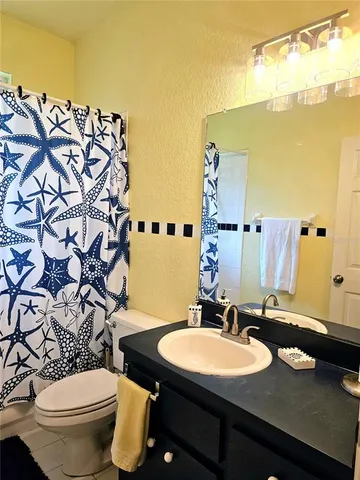 a view of a livingroom with furniture and windows