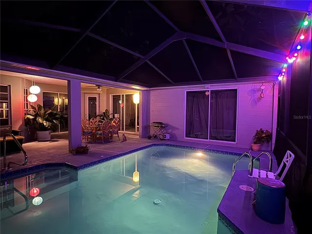 a room with furniture a projector and a flat screen tv