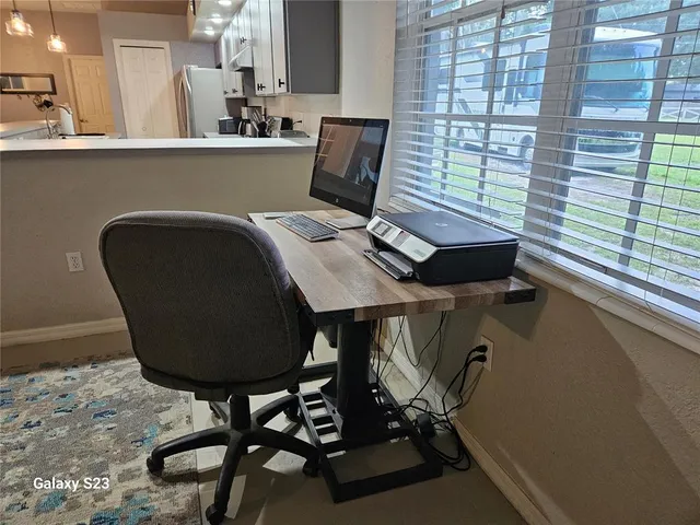 a balcony with table and chairs